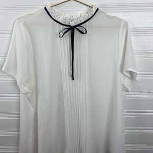 White blouse with black bow